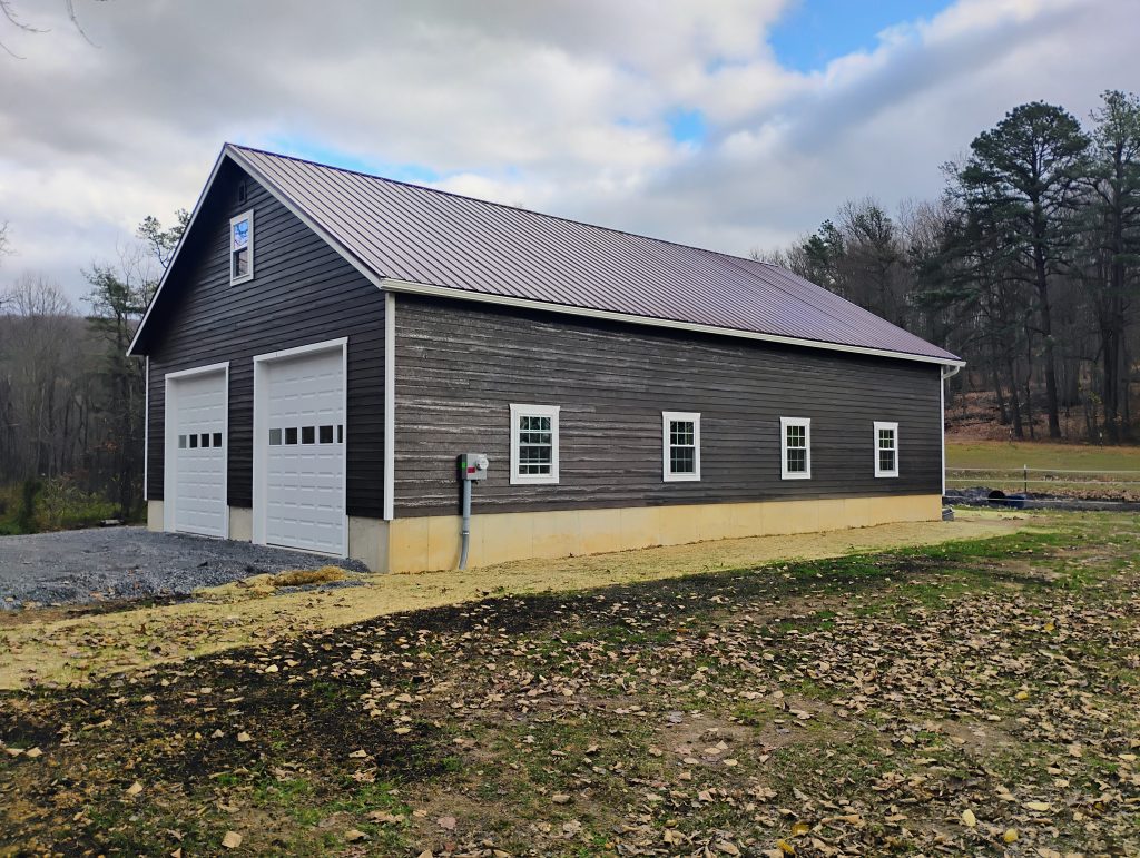 2-car garage with wooden siding