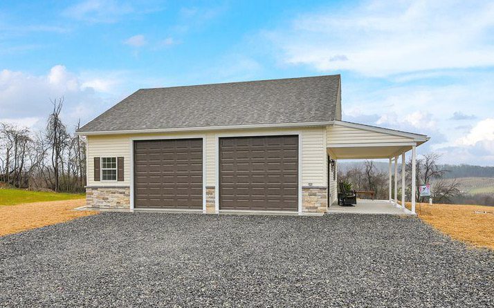 a driveway leading up to a custom 2-car garage